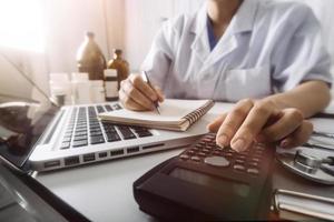 Medicine doctor and stethoscope touching icon medical network connection with modern interface on digital tablet in hospital background. Medical technology network concept photo