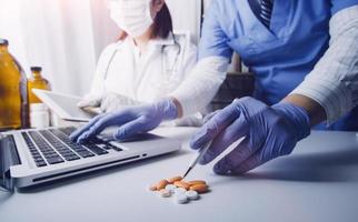 Medicine doctor and stethoscope touching icon medical network connection with modern interface on digital tablet in hospital background. Medical technology network concept photo