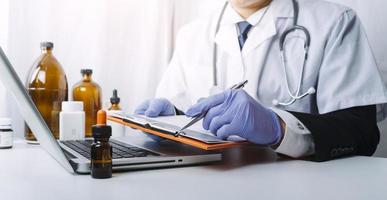 Medicine doctor and stethoscope touching icon medical network connection with modern interface on digital tablet in hospital background. Medical technology network concept photo