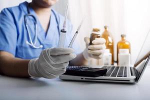 Medicine doctor and stethoscope touching icon medical network connection with modern interface on digital tablet in hospital background. Medical technology network concept photo