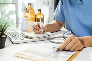 Medicine doctor and stethoscope touching icon medical network connection with modern interface on digital tablet in hospital background. Medical technology network concept photo