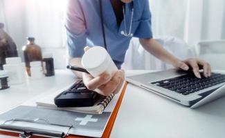 Medicine doctor and stethoscope touching icon medical network connection with modern interface on digital tablet in hospital background. Medical technology network concept photo