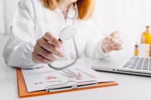 Medicine doctor and stethoscope touching icon medical network connection with modern interface on digital tablet in hospital background. Medical technology network concept photo