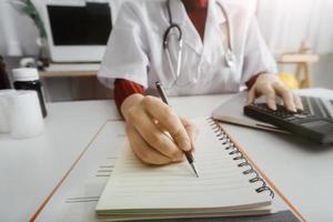 Medicine doctor and stethoscope touching icon medical network connection with modern interface on digital tablet in hospital background. Medical technology network concept photo