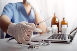 Medicine doctor and stethoscope touching icon medical network connection with modern interface on digital tablet in hospital background. Medical technology network concept photo