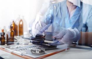 Medicine doctor and stethoscope touching icon medical network connection with modern interface on digital tablet in hospital background. Medical technology network concept photo