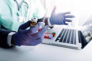 Medicine doctor and stethoscope touching icon medical network connection with modern interface on digital tablet in hospital background. Medical technology network concept photo