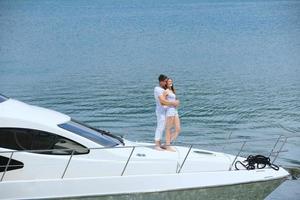 young couple on yacht photo