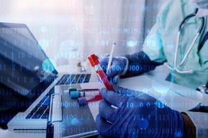 Medicine doctor and stethoscope touching icon medical network connection with modern interface on digital tablet in hospital background. Medical technology network concept photo
