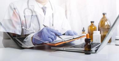 Medicine doctor and stethoscope touching icon medical network connection with modern interface on digital tablet in hospital background. Medical technology network concept photo