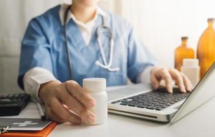Medicine doctor and stethoscope touching icon medical network connection with modern interface on digital tablet in hospital background. Medical technology network concept photo