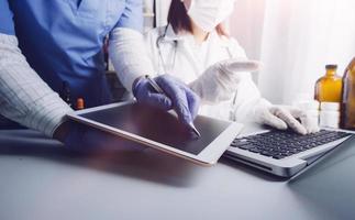 Medicine doctor and stethoscope touching icon medical network connection with modern interface on digital tablet in hospital background. Medical technology network concept photo