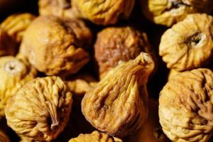 sweet dried figs in an olive wood bowl photo
