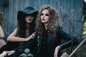 Two vintage witches gathered eve of Halloween photo