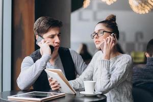 Guy and girl at a meeting in a cafe photo