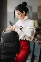 Fashionable woman hold black bag photo