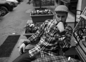 The man in the authentic boots and selvedge jeans  sitting at the table photo