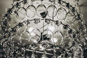 Beautiful chandelier made with glasses of wine photo