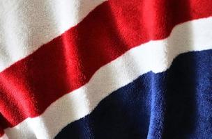 Detailed close up view on samples of cloth and fabrics in different colors found at a fabrics market photo