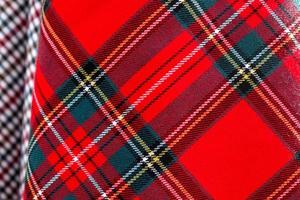 Detailed close up view on samples of cloth and fabrics in different colors found at a fabrics market photo