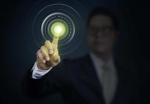 Business Man pushing a power button on touch screen interface. Business technology, internet and networking concept. photo