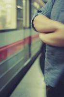 Blurry image of a man hands in a subway photo