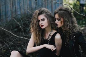 Two vintage witches gathered eve of Halloween photo