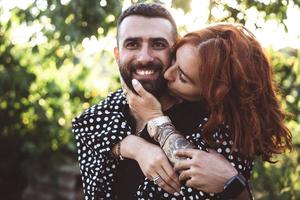 loving guy and girl posing together on camera photo