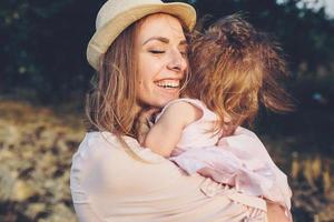 mother and daughter together outdoors photo