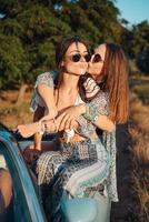 Two girls have fun in the countryside photo