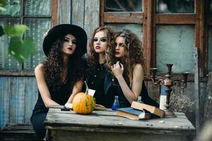 three vintage women as witches photo