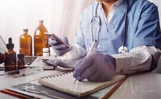 Medicine doctor and stethoscope touching icon medical network connection with modern interface on digital tablet in hospital background. Medical technology network concept photo