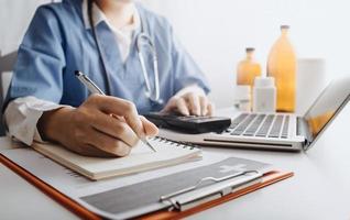 Medicine doctor and stethoscope touching icon medical network connection with modern interface on digital tablet in hospital background. Medical technology network concept photo