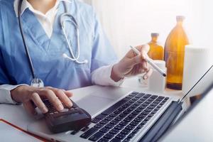 Medicine doctor and stethoscope touching icon medical network connection with modern interface on digital tablet in hospital background. Medical technology network concept photo