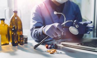 Medicine doctor and stethoscope touching icon medical network connection with modern interface on digital tablet in hospital background. Medical technology network concept photo