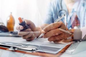 Medicine doctor and stethoscope touching icon medical network connection with modern interface on digital tablet in hospital background. Medical technology network concept photo