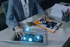 Cyber Security Internet And Networking Concept. Businessman Hand Working With laptop computer and Padlock Icon on screen. Digital crime by an anonymous hacker, data protection. photo