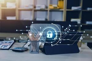 Cybersecurity and privacy concepts to protect data. Lock icon and internet network security technology. Businessman protecting personal data on smart phone with virtual screen interfaces. photo