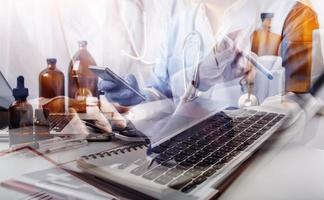 Medicine doctor and stethoscope touching icon medical network connection with modern interface on digital tablet in hospital background. Medical technology network concept photo