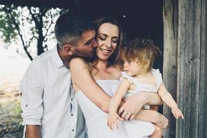 mother, father and daughter together having fun photo
