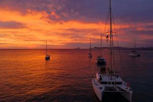 Aerial view from drone on boats shipping in sea, sunset photo