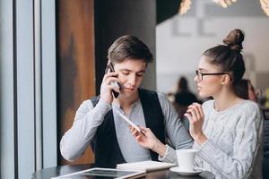 Guy and girl at a meeting in a cafe photo