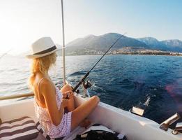 Attractive girl on a yacht photo