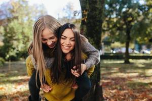 Two girls having fun in the park photo
