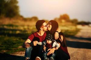 young family with a child on the nature photo