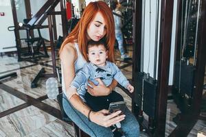 Mother with her son in the gym photo