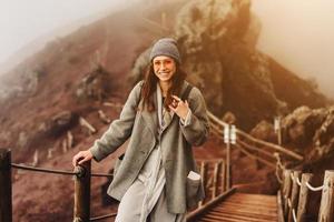 Girl climbs the path to the mountain photo