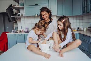 Happy family cook together in the kitchen photo
