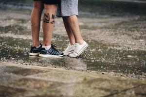 couple on the background of wet asphalt photo