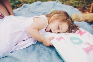 Young beautiful woman with her child outdoors photo